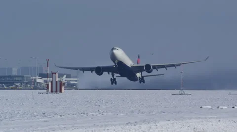 Airplane on take off during a winter day with snow and clear sky Stock Footage 46000374
