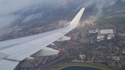 Airplane Take-Off Flying Through Broken Clouds Over London 動画素材 300615864