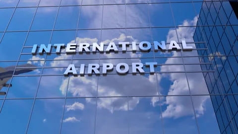 Airplane take off in reflection of the glass windows of the airport building Видео 162533811