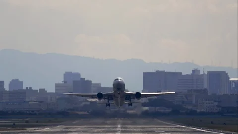 Airplane to take off from the runway - Tilt up Stock Footage 98146014