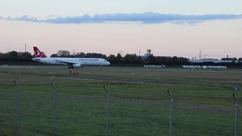 Airplane take off at sunset Stock Footage 119870639