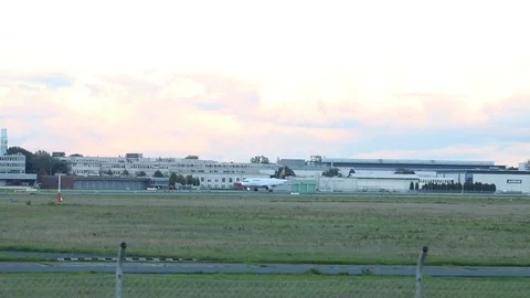 Airplane take off at sunset Stock Footage 119870709