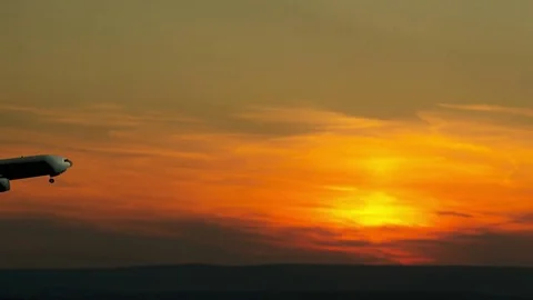 Airplane takeoff into evening sky Stock Footage 76039378