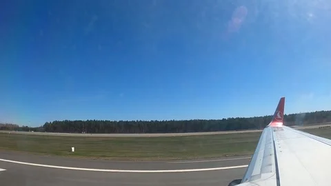 Airplane takeoff from Riga Airport window view on a sunny day Vidéo 337057353