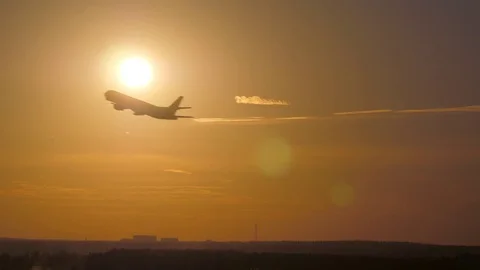Airplane takeoff at sunset Stock Footage 85365813