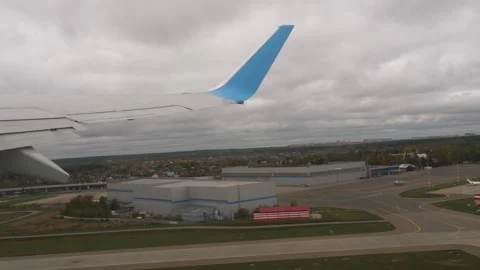 Airplane takeoff, view from the window onto the wing Stock Footage 285658443