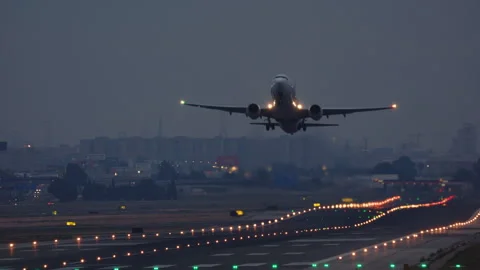 Airplane Takes Off from Runway at Dusk Stock Footage 335011626