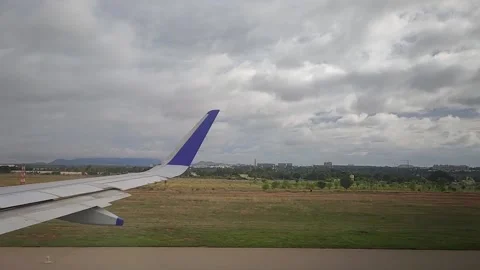 Airplane taking off after moving through runway, view from window, FullHD 1080p Stock Footage 138679359
