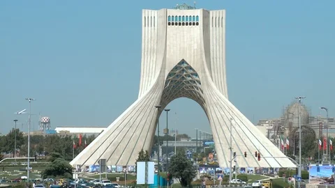 Airplane taking off behind The Azadi Tower in Tehran, Iran Stock Footage 119778082
