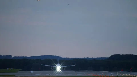 Airplane taking off at dusk Stock Footage 268210058
