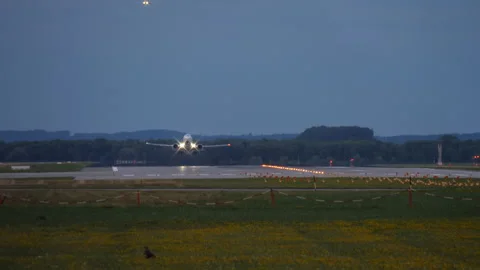 Airplane taking off with lights on Stock Footage 270063296