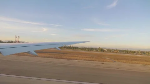 Airplane taking off from Los Angeles in slow motion in 4k slow motion 60fps Stock Footage 282986706