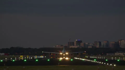 Airplane taking off at night 動画素材 300617044