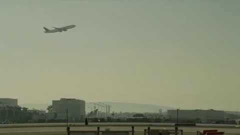 Airplane taking off over LAX Stock Footage 197493308