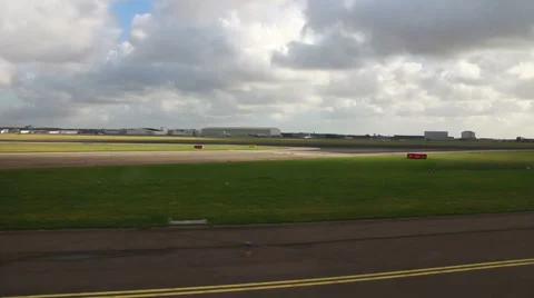 Airplane taking off on runway, shot from the window of plane Stock Footage 35220943