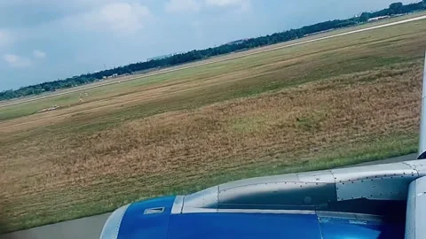 Airplane taking off from runway into sky Stock Footage 333454036