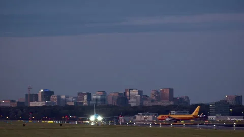 Airplane taking off from runway at sunset Stock Footage 300645740