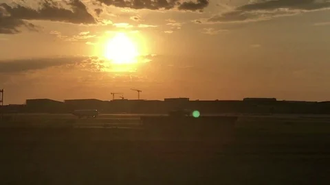 Airplane taking off at sunset Stock Footage 78556985