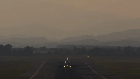 Airplane taking off at sunset Stock Footage 256761570