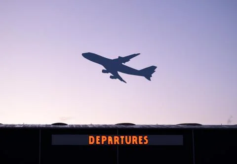 Airplane Taking Off At Sunset Stock Photos