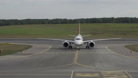 Airplane taxiing towards camera. Front view Stock Footage 215920860