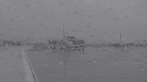 Airplane at the Terminal during a Storm Stock-Footage 154005567