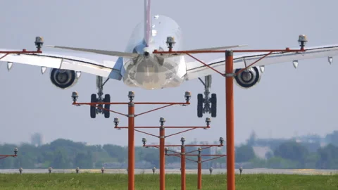 Airplane touching down in 4k slow motion 60fps Stock Footage 94430727