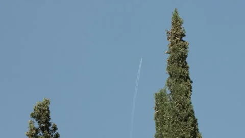 Airplane with trail in the sky Stock Footage 254423239