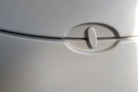 Airplane tray table latch close up minimal cabin interior detail travel concept Фото