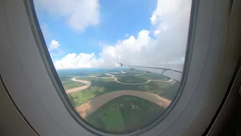 Airplane turbulence view from plane window seat. Crashing into big white clou Stock Footage 293777993