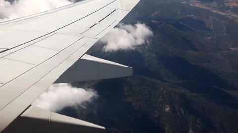 Airplane turning, wing and engine from passenger seat window view Stock Footage 45158984