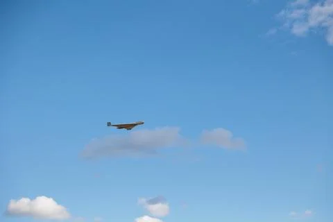 An airplane-type attack drone is flying in sky Stock Photos