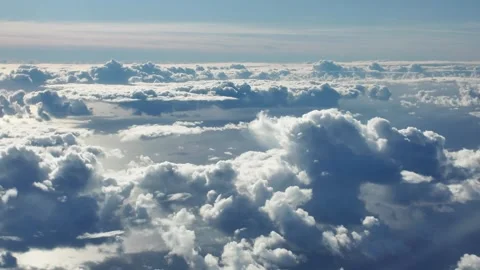 Airplane View Above Cumulus Clouds at Sunset. Stock Footage 328995525