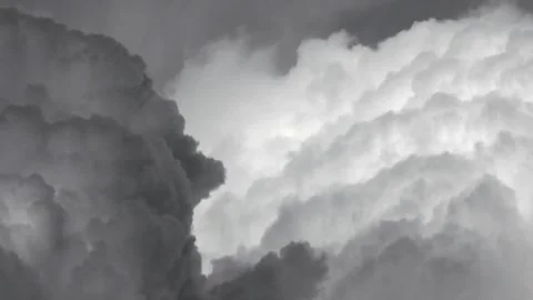 Airplane view above thick foamy and cumulonimbus storm clouds - Vapor Movement Stock Footage 339340338