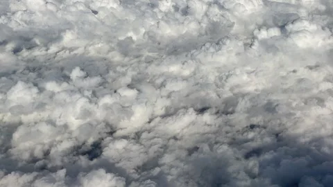 Airplane view of fluffy clouds Stock Footage 272177750