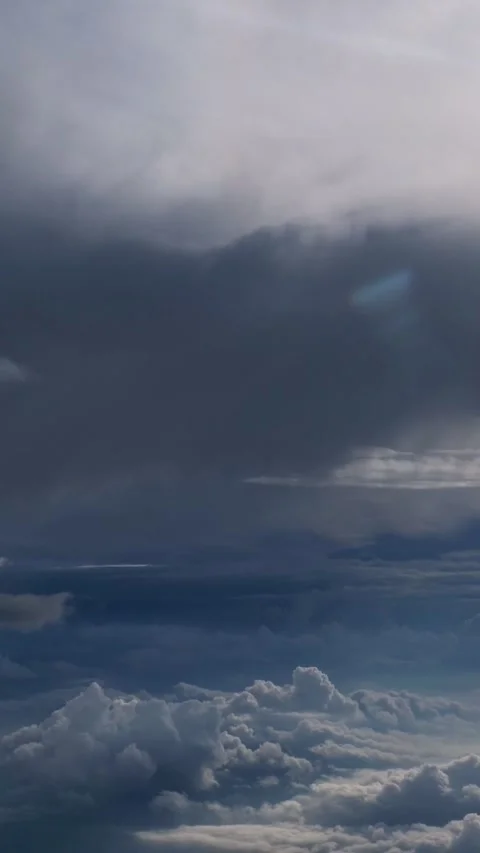 Airplane view flying over dramatic dark storm clouds Video stock 341445462