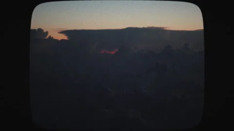 Airplane view of lightning strikes in the clouds at sunset. Stormy sky with l Stock Footage 136317178