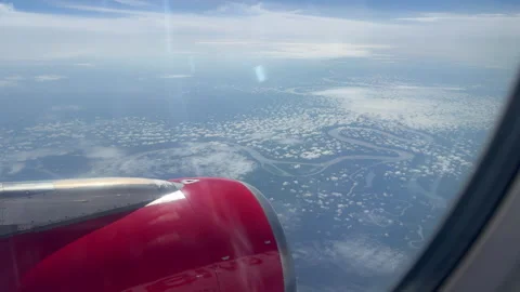 Airplane View of Meandering River and Cloud Patterns Over Amazon Stock Footage 336477502