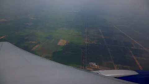 Airplane view over the city from the window Stock Footage 116859857