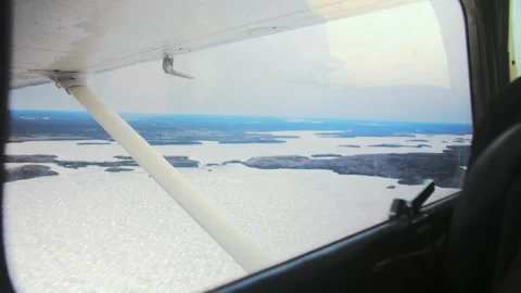 Airplane view from small aviation.Flying by aircraft sky landscape horizon.Snow Stock Footage 253240751