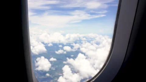 Airplane view from the window with clouds in sky Stock Footage 206769720
