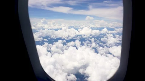 Airplane view from the window with clouds in sky Stock Footage 206773796