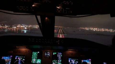 Airplane was touching down on the runway in airport at night of runway from i Stock Footage 100624782