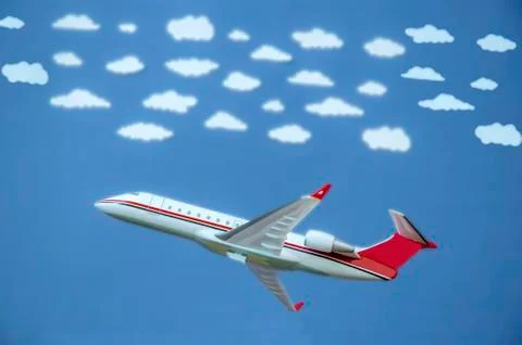 Airplane with white clouds Stock Photos