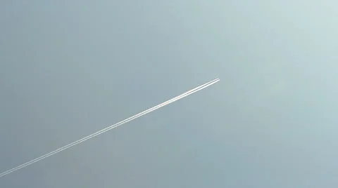 Airplane white path on blue sky, abstract environment pollution. Stock Footage 42935365