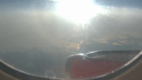 Airplane Window Bright Sunset Over Atlantic Handheld, 4K Stock Footage 126912754