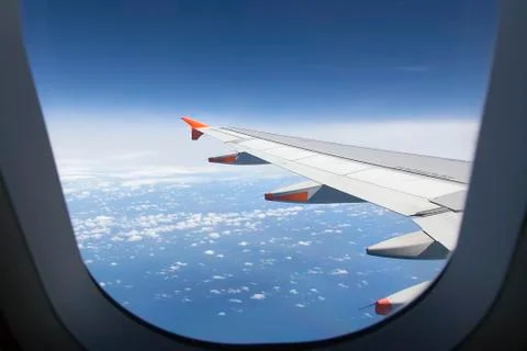 Airplane Window during flight Stock Photos