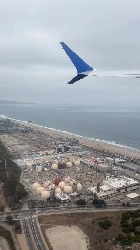 Airplane Window POV During Takeoff Above California Coastline Vertical 4K Stock Footage 336812232