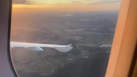 Airplane Window POV View Flying Right Over Berlin Brandenburg Landscape at Sunse Stock Footage 339688204