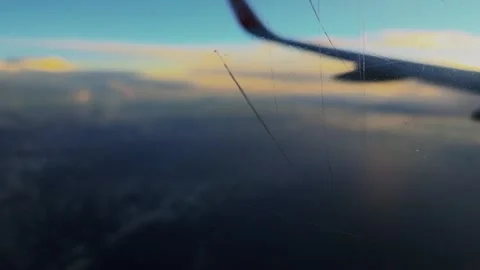 Airplane Window Scratch With Blurred Wing Stock Footage 345374563